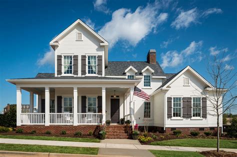 white house with brown metal roof|white house brown shutters.